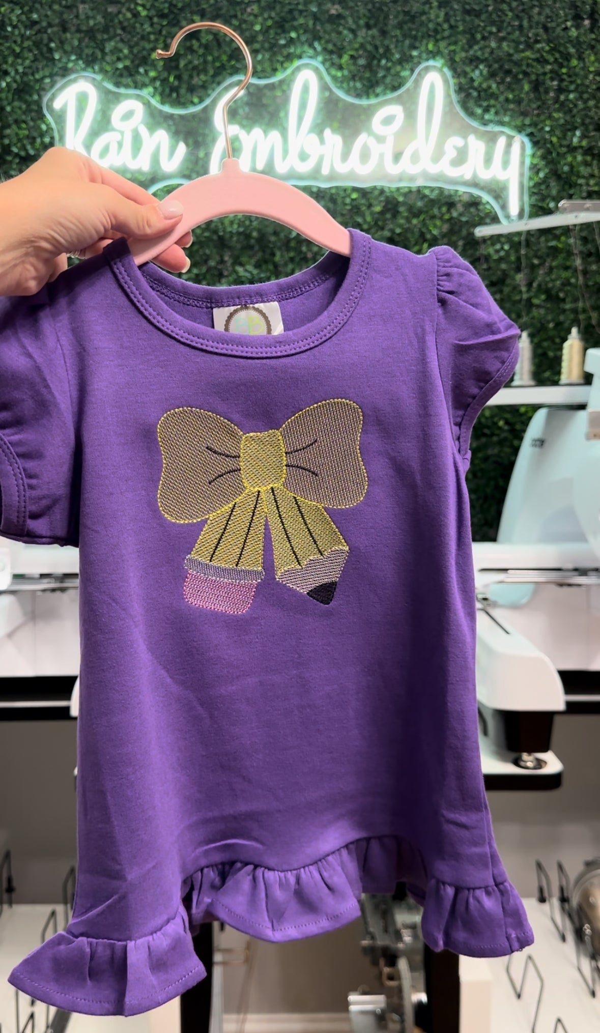 Pencil Bow Embroidered Ruffle Tee