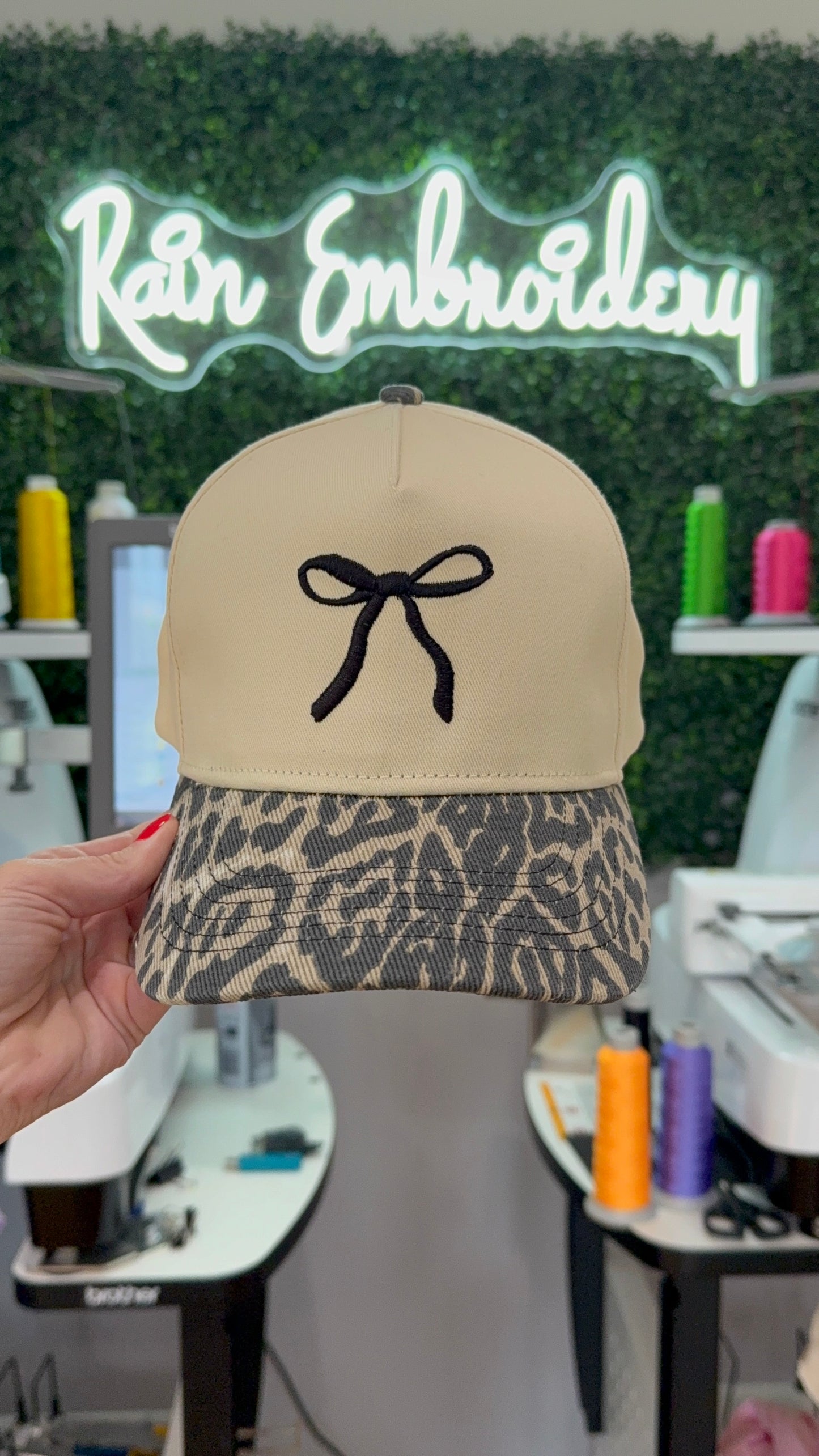 Black Bow Embroidered Leopard Trucker Hat