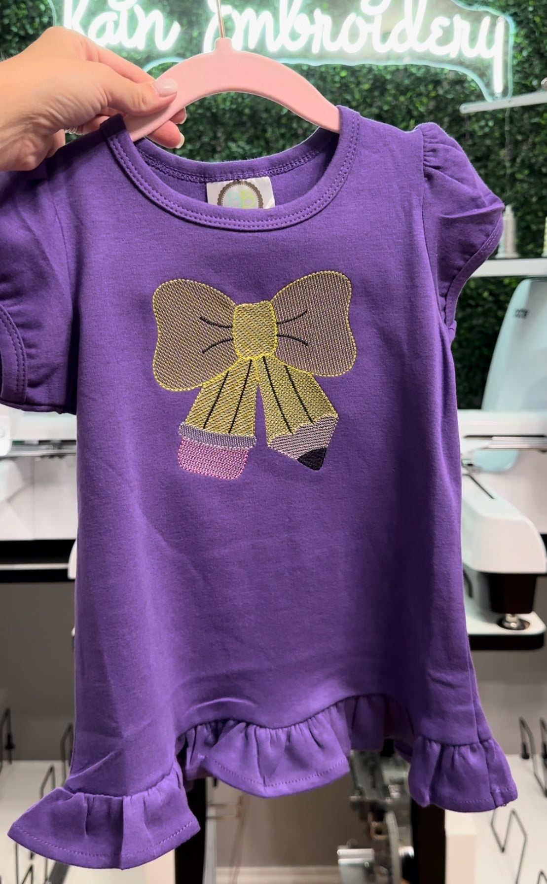 Pencil Bow Embroidered Ruffle Tee